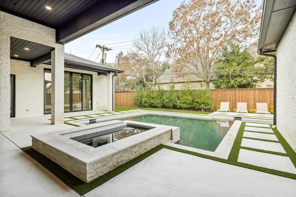 6123 Northaven Road Dallas, TX 75230 - Photo 37 of 40 The pool and spa sit at the center of the backyard, creating a space that works just as well for quiet afternoons as it does for hosting friends