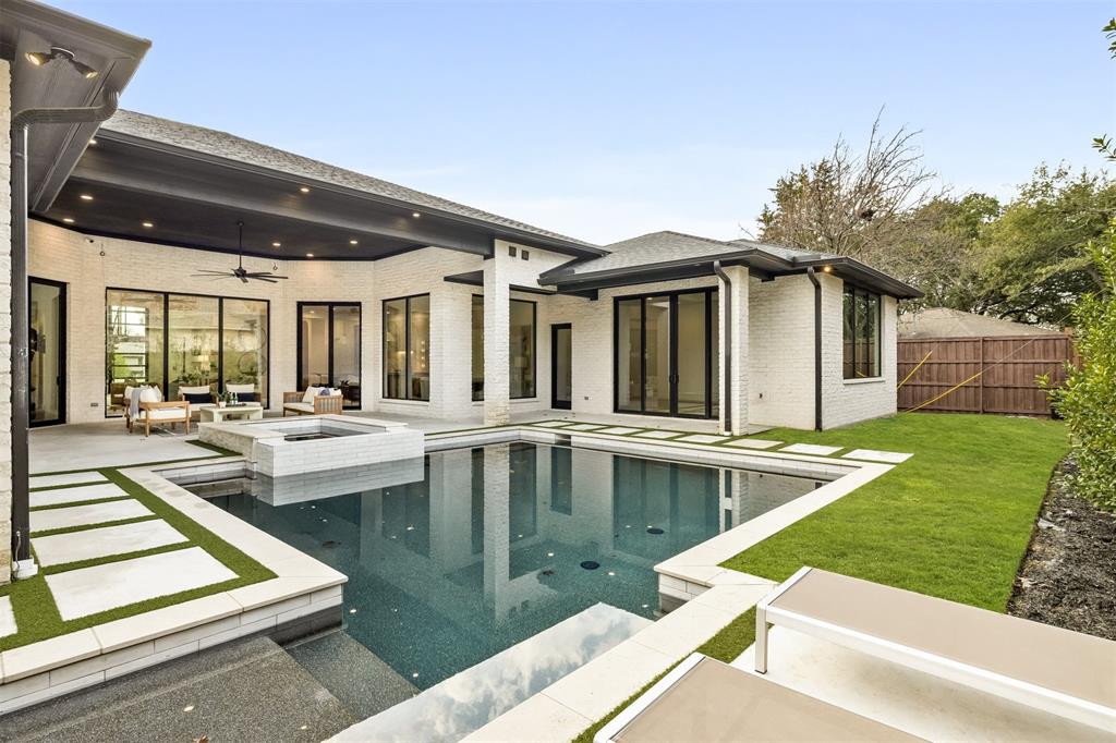 6123 Northaven Road Dallas, TX 75230 - Photo 39 of 40 Thoughtfully designed landscaping surrounds the pool and spa, adding privacy and giving the backyard a finished, established feel