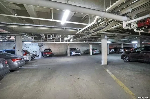 a view of parking garage with cars