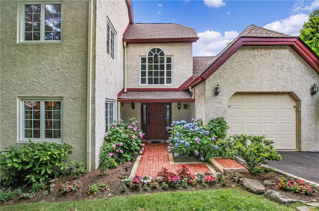 Beautiful gardens frame this welcoming entrance!