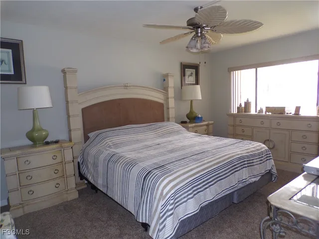 a bathroom with a granite countertop sink and mirror