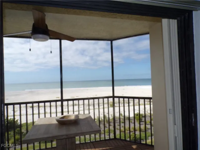 a view of a field with an ocean