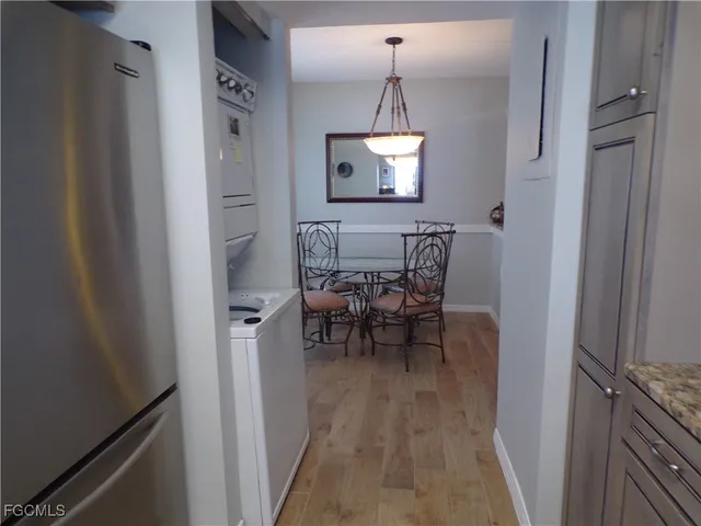 a dining room with furniture and wooden floor
