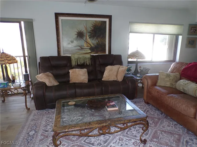 a living room with furniture and a rug