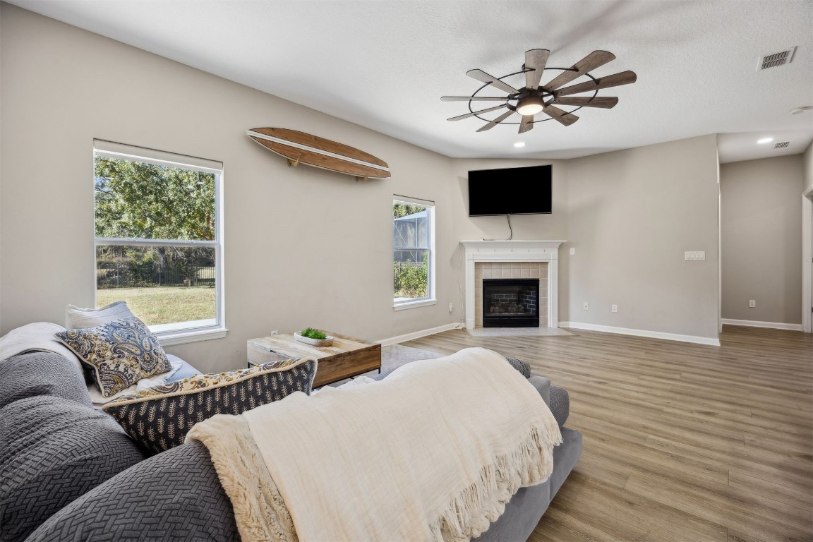 86126 Remsenburg Drive Fernandina Beach, FL 32034 - Photo 14 of 54 a living room with furniture fireplace and flat screen tv
