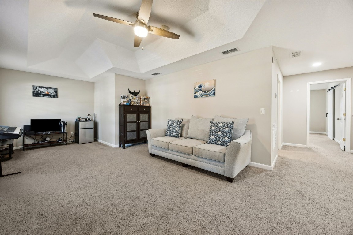 86126 Remsenburg Drive Fernandina Beach, FL 32034 - Photo 17 of 54 a living room with furniture and a flat screen tv