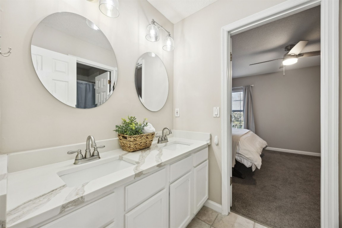 86126 Remsenburg Drive Fernandina Beach, FL 32034 - Photo 21 of 54 a bathroom with a sink and a mirror