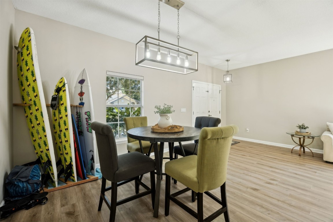 86126 Remsenburg Drive Fernandina Beach, FL 32034 - Photo 6 of 54 a view of a dining room with furniture and wooden floor