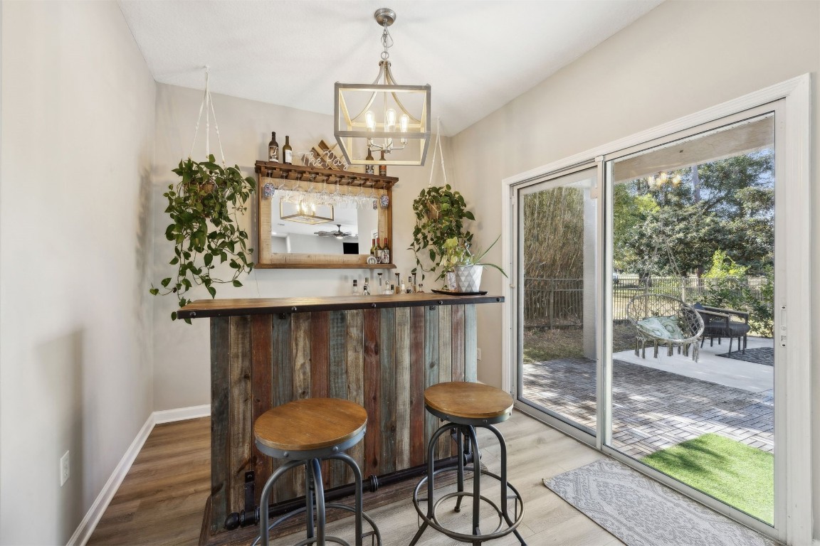 86126 Remsenburg Drive Fernandina Beach, FL 32034 - Photo 7 of 54 a view of a dining room with furniture window and wooden floor