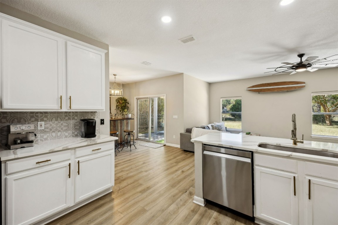86126 Remsenburg Drive Fernandina Beach, FL 32034 - Photo 10 of 54 a kitchen with a sink stove and cabinets