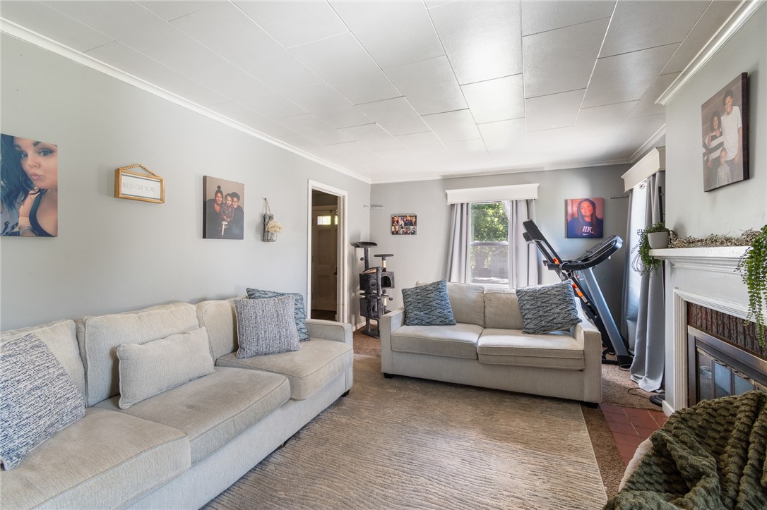 6170 Locust Street Williamson, NY 14589 - Photo 5 of 26 The living room - spacious and bright!