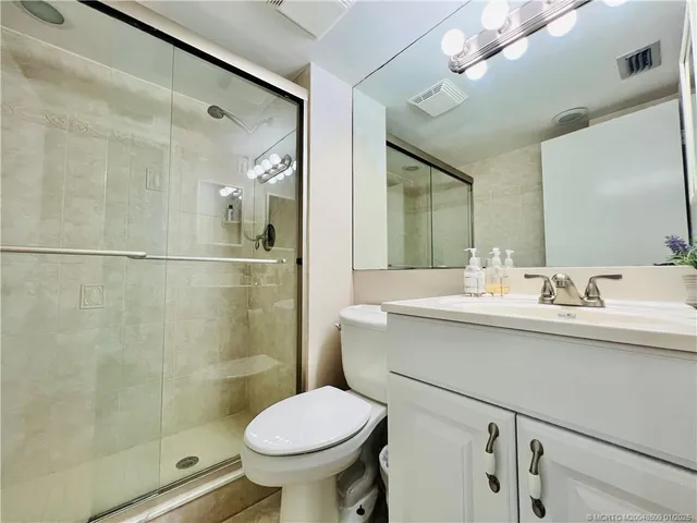 a view of a house with a flower garden