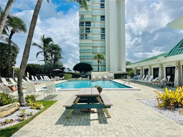 a view of balcony with wooden floor