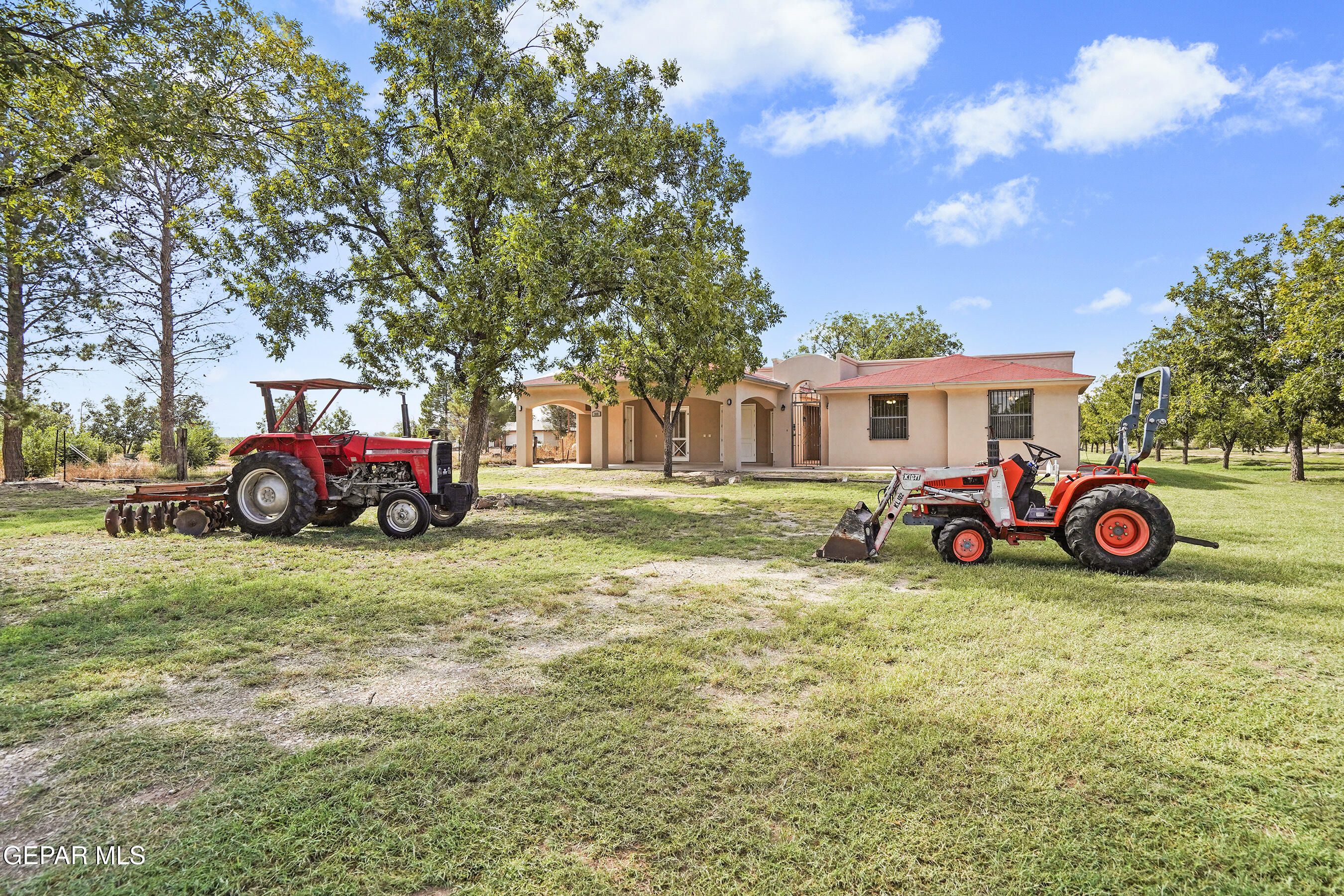 a view of a house with a yard and garage