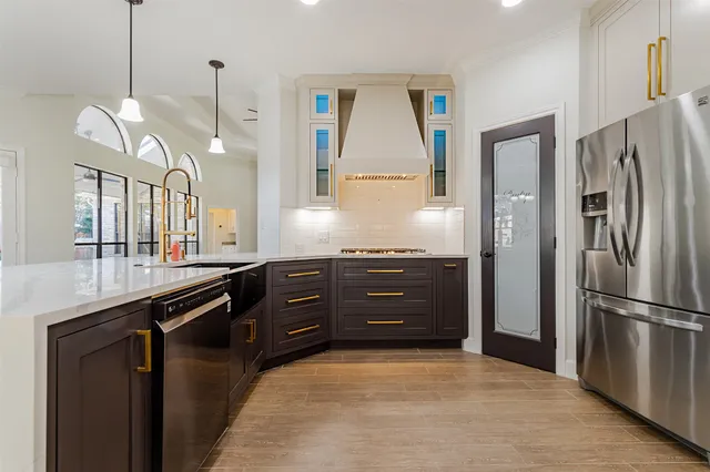a view of empty room with wooden floor and window