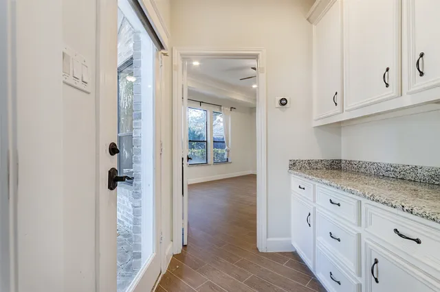 a white bath tub sitting in a bathroom next to a window
