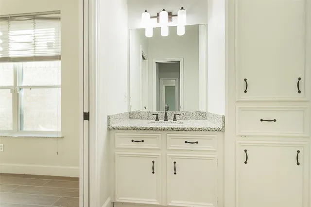 a view of an empty room and wooden floor