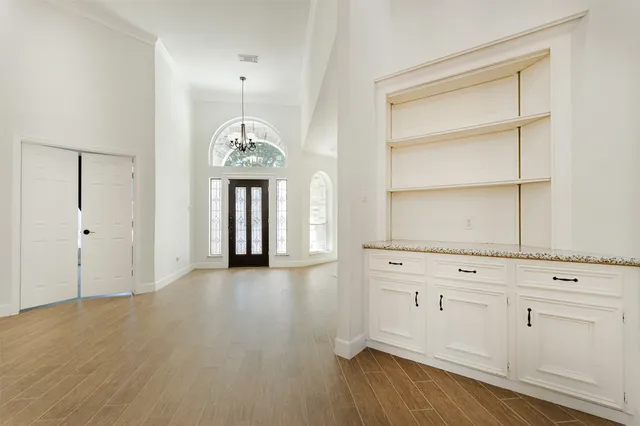 a kitchen with stainless steel appliances kitchen island granite countertop a refrigerator and a stove top oven