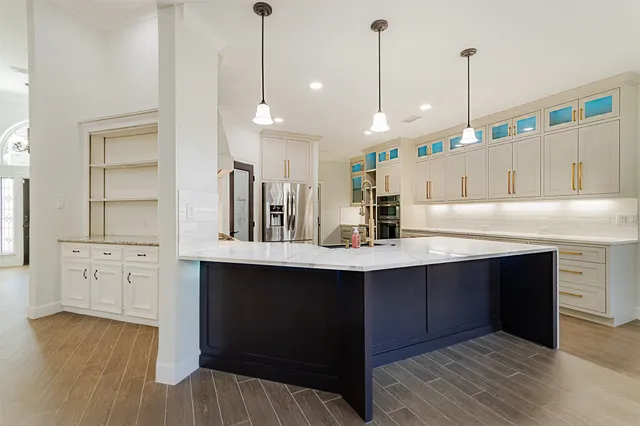 a view of a kitchen with refrigerator