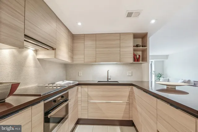 a kitchen with a sink cabinets and appliances