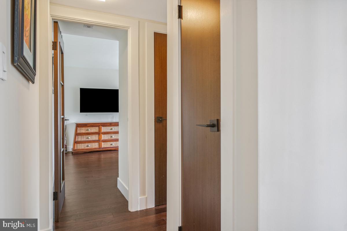 1080 Wisconsin Avenue Northwest, Unit 3002 Washington, DC 20007 - Photo 14 of 38 a view of a hallway with wooden floor windows and livingroom