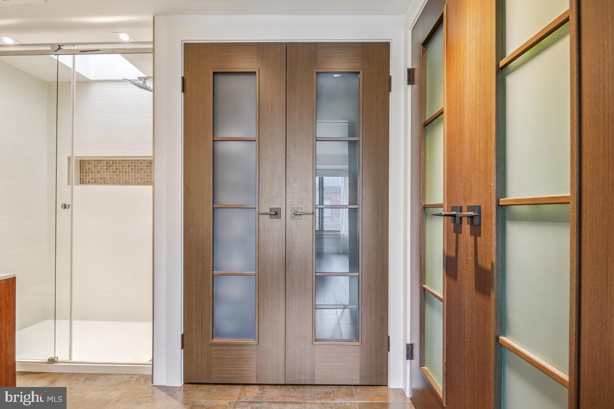 1080 Wisconsin Avenue Northwest, Unit 3002 Washington, DC 20007 - Photo 20 of 38 a bathroom with a glass shower door