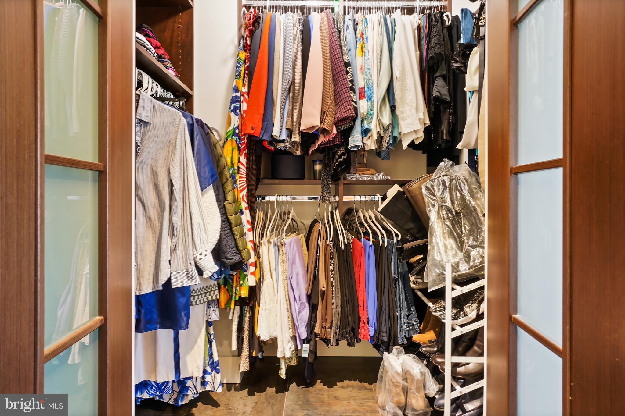 1080 Wisconsin Avenue Northwest, Unit 3002 Washington, DC 20007 - Photo 22 of 38 a view of walk in closet with clothes