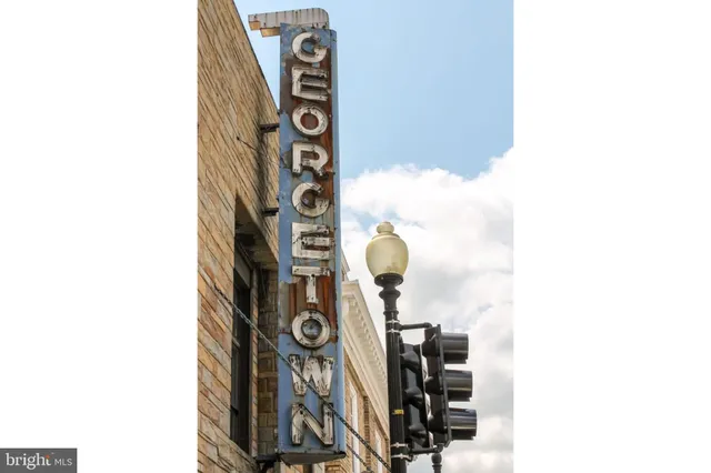 a front view of a building with bench