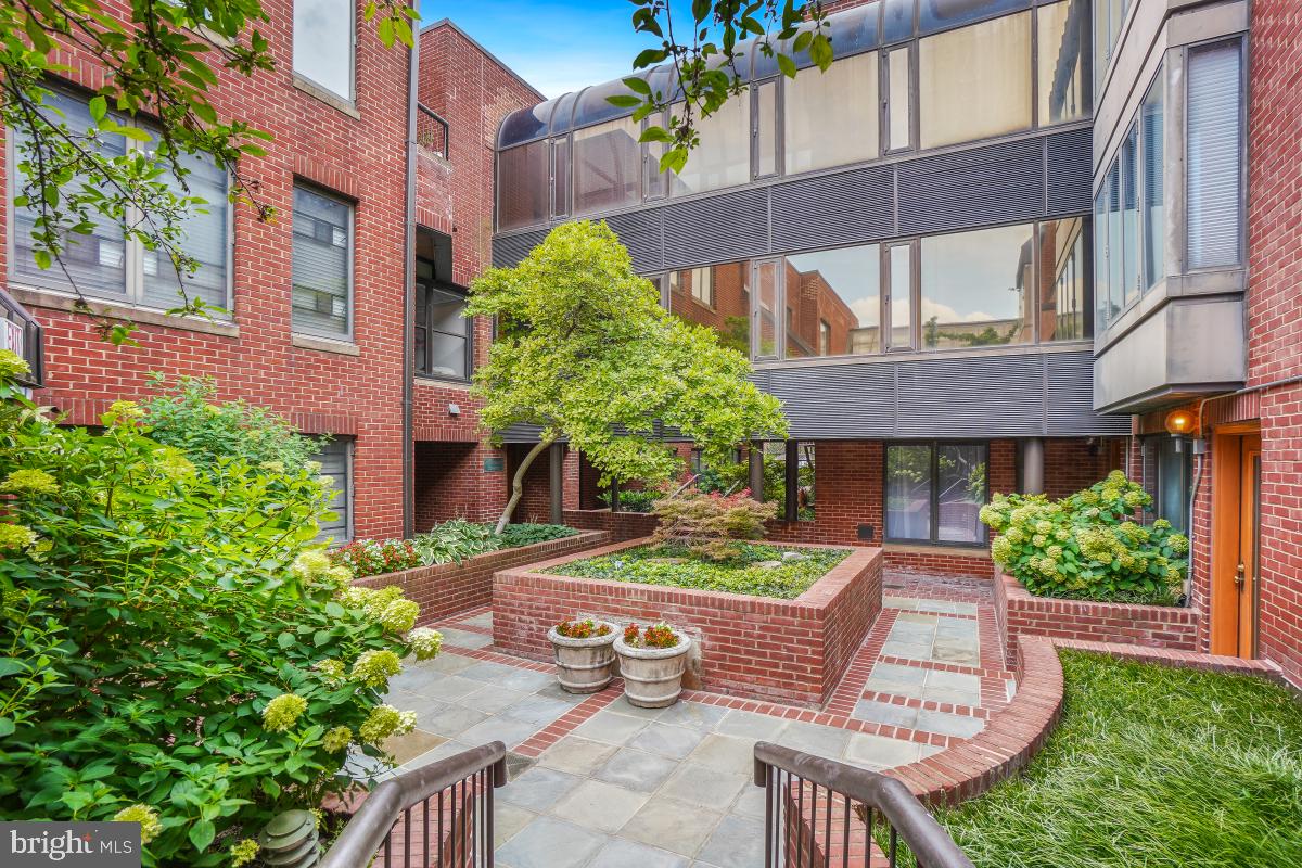 1080 Wisconsin Avenue Northwest, Unit 3002 Washington, DC 20007 - Photo 30 of 38 a front view of a house with garden