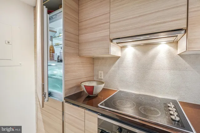 a close view of light fixtures and wooden floor