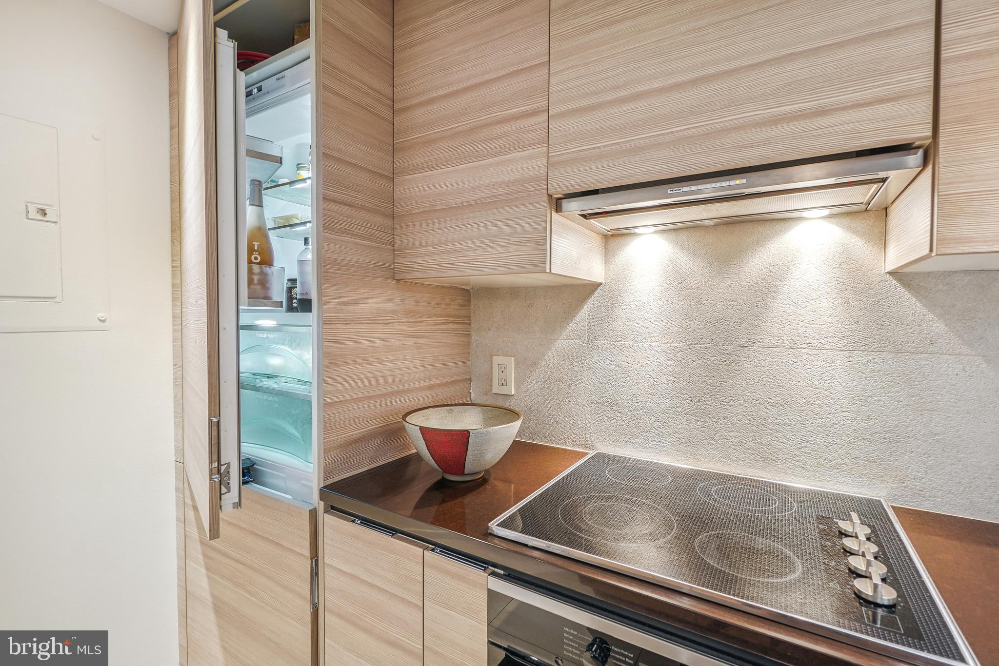 1080 Wisconsin Avenue Northwest, Unit 3002 Washington, DC 20007 - Photo 3 of 38 a close view of light fixtures and wooden floor