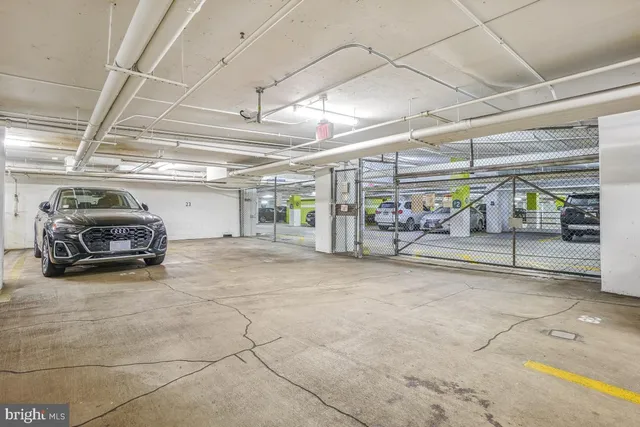 a view of a garage with wooden cabinets