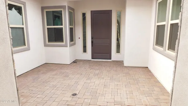 a view of an empty room with windows