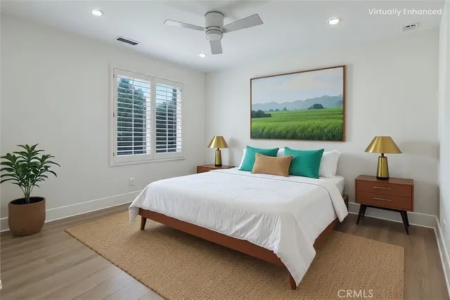 a bedroom with bed and window