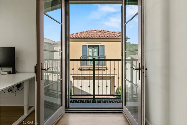a view of a hallway with a door and a window