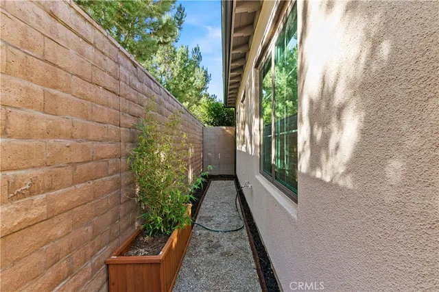 a view of a pathway both side of house