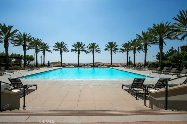 a view of a swimming pool with a lounge chair