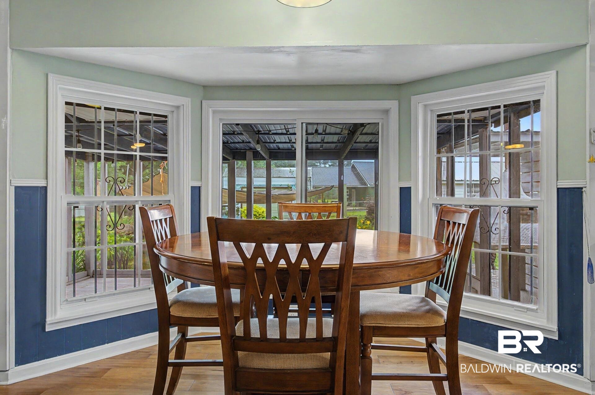 3791 Robinsonville Road Atmore, AL 36502 - Photo 28 of 47 Dining area featuring wood-finish flooring and a distinctive bay window configuration