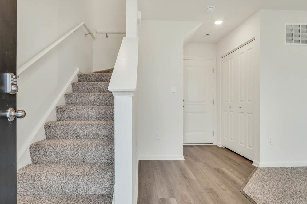 585 Yosemite Way Mundelein, IL 60060 - Photo 7 of 59 a view of an entryway with wooden floor