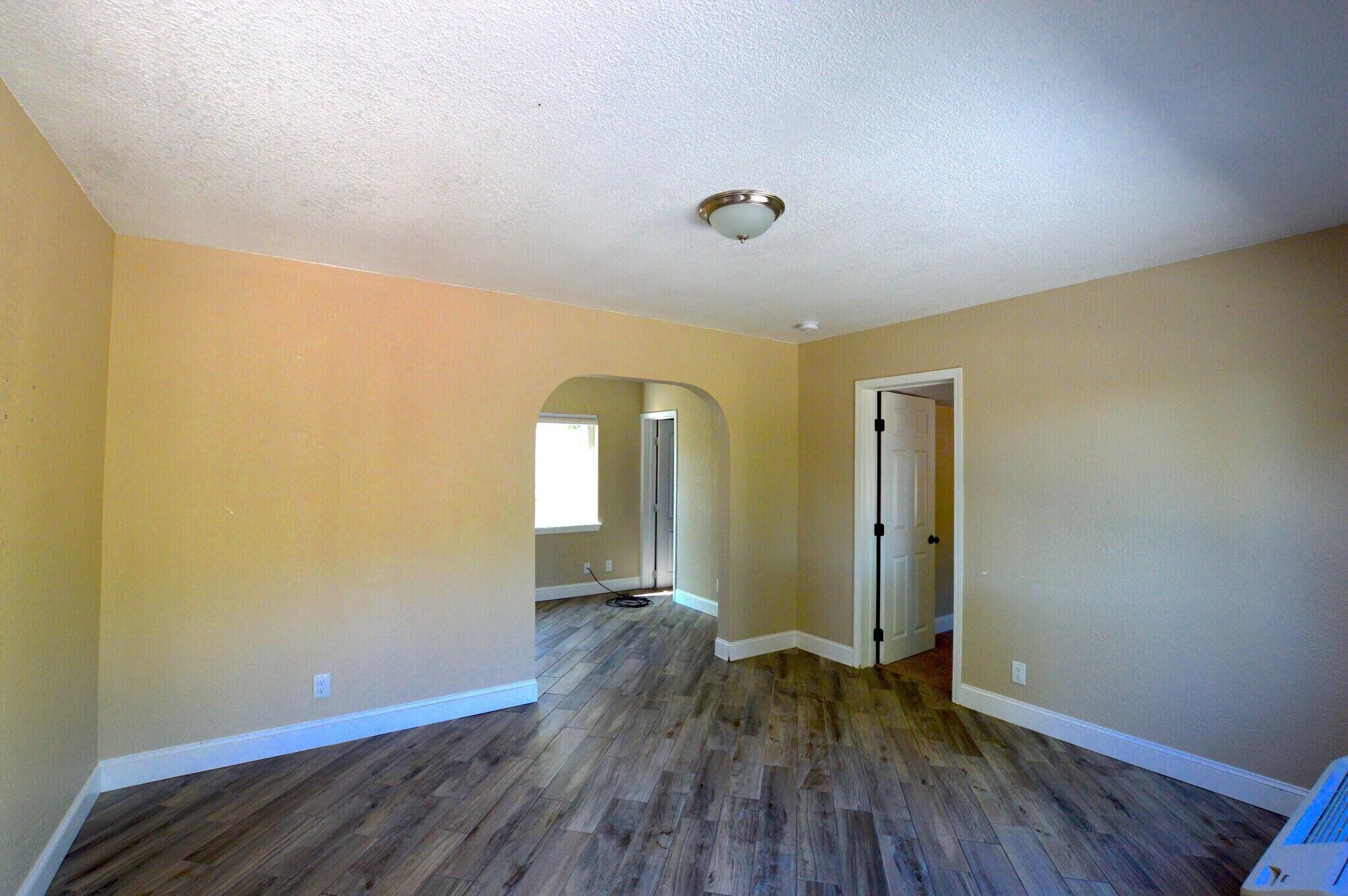 2230 El Reno Lane Redding, CA 96001 - Photo 16 of 27 a view of empty room with wooden floor