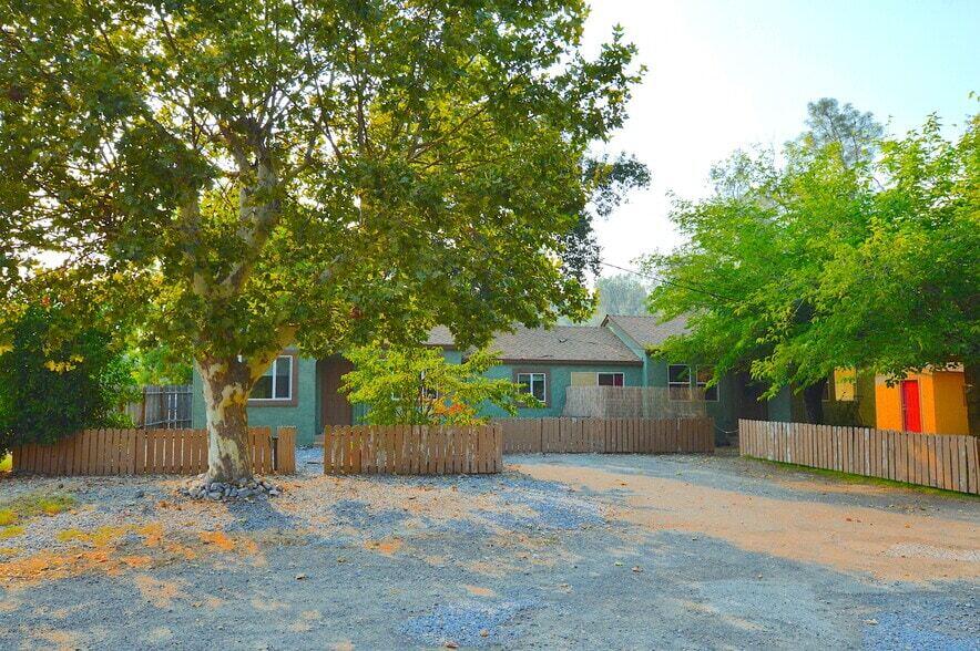 2230 El Reno Lane Redding, CA 96001 - Photo 2 of 27 front view of a house with a tree