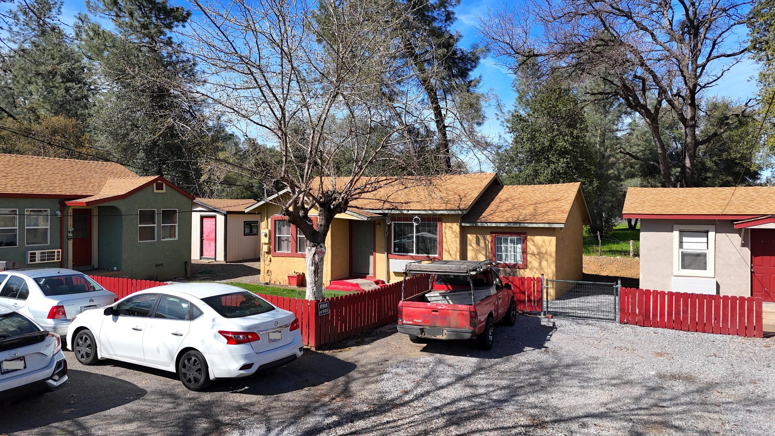 2230 El Reno Lane Redding, CA 96001 - Photo 3 of 10 a car parked in front of a white house