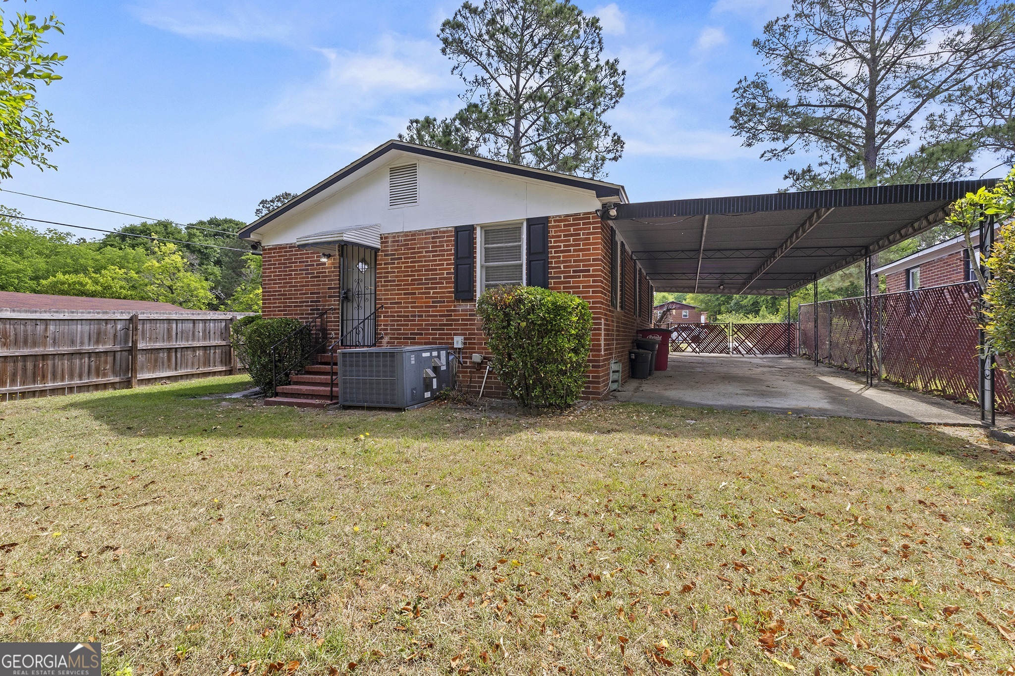701 Grayson Avenue Macon, GA 31204 - Photo 16 of 17 a backyard of a house with table and chairs