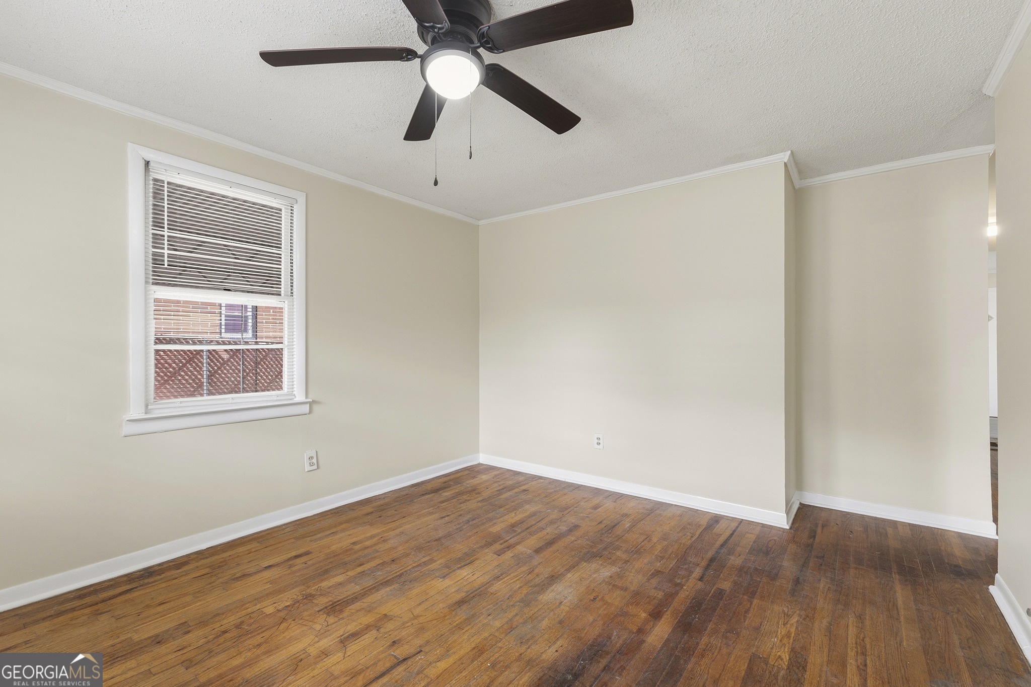 701 Grayson Avenue Macon, GA 31204 - Photo 5 of 17 wooden floor in an empty room with a window