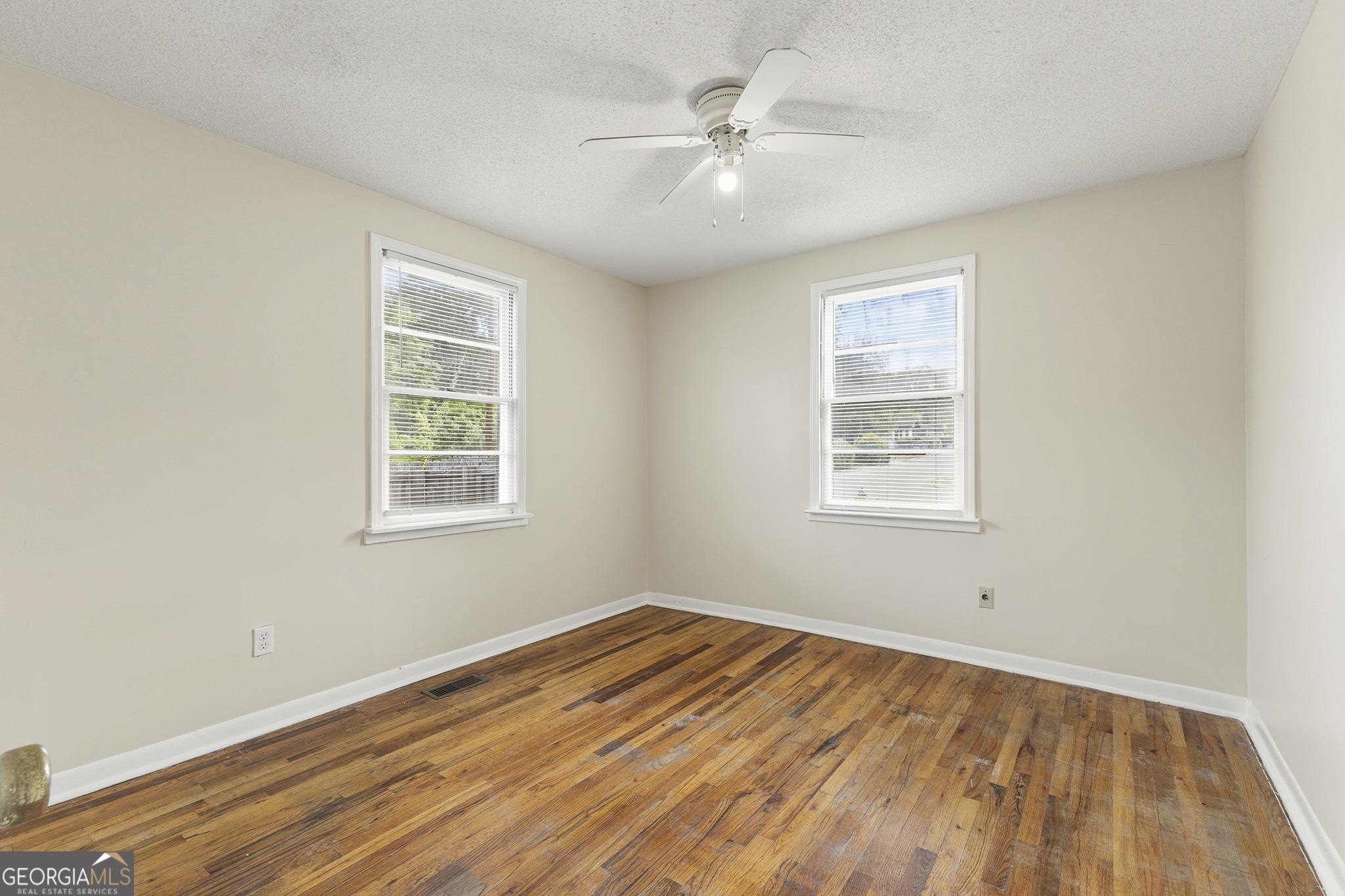701 Grayson Avenue Macon, GA 31204 - Photo 8 of 17 wooden floor in an empty room with a window