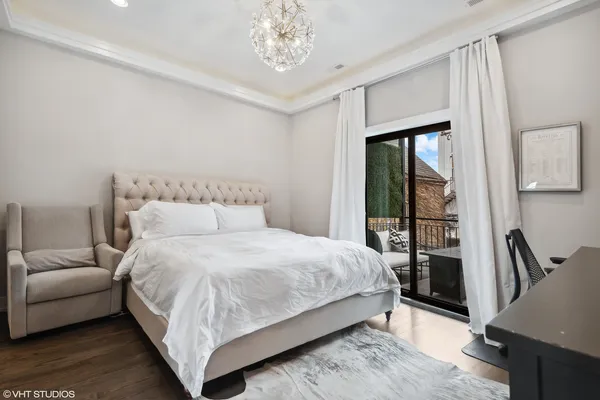 a bedroom with a large bed and a large window