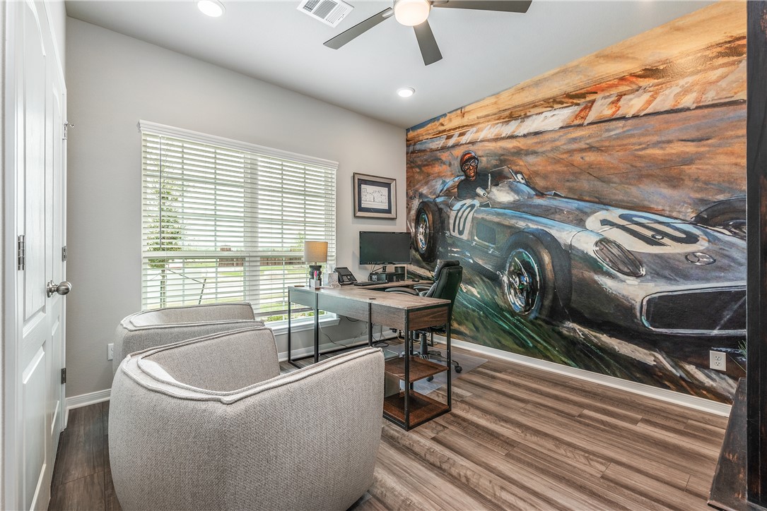6309 Raleigh Drive College Station, TX 77845 - Photo 10 of 18 a living room with a couch and a chandelier