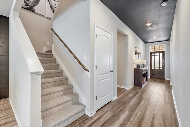 a living room with a couch and a chandelier