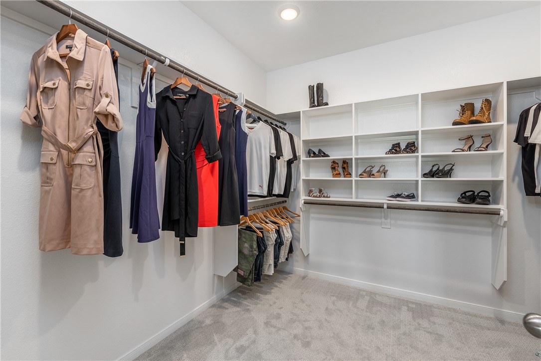 6309 Raleigh Drive College Station, TX 77845 - Photo 8 of 18 a view of walk in closet with clothes and shoes