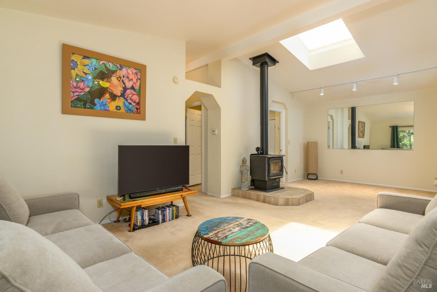 35551 Ocean View Street Gualala, CA 95445 - Photo 13 of 26 a living room with furniture and a flat screen tv